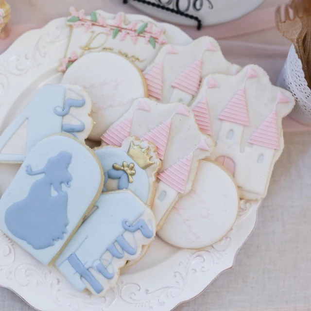 Artisanal sugar cookies with fairytale decorations on a vintage plate